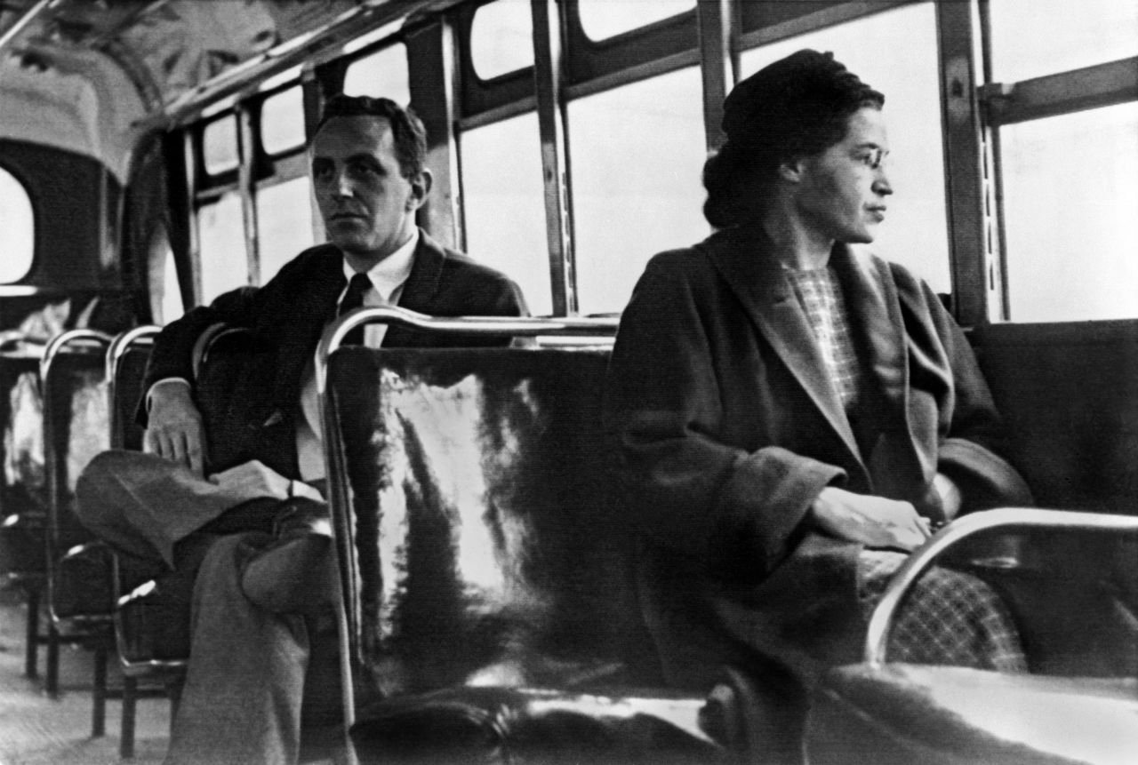 Rosa Parks <a href="http://www.cnn.com/2010/US/12/01/rosa.parks.anniversary/index.html">became one of the major symbols of the civil rights movement</a> after she was arrested in Montgomery, Alabama, for refusing to give up her seat to a white passenger in 1955. For 381 days, African-Americans boycotted public transportation to protest Parks' arrest and, in turn, segregation laws. The boycott led to a Supreme Court ruling desegregating public transportation in Montgomery. In this photo, Parks rides the bus a day after the Supreme Court ruling in 1956.