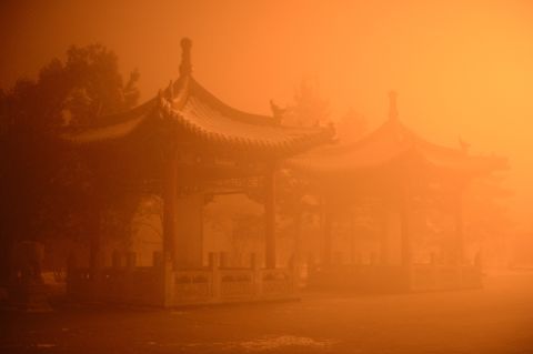 The pollution cast an apocalyptic glow over the pagodas on the streets of Hohhot, Inner Mongolia  on November 29.