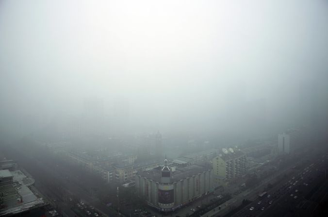 Buildings are shrouded by heavily polluted haze in Beijing on November 30. China's capital and neighboring regions have seen the worst smog of the year this week. 