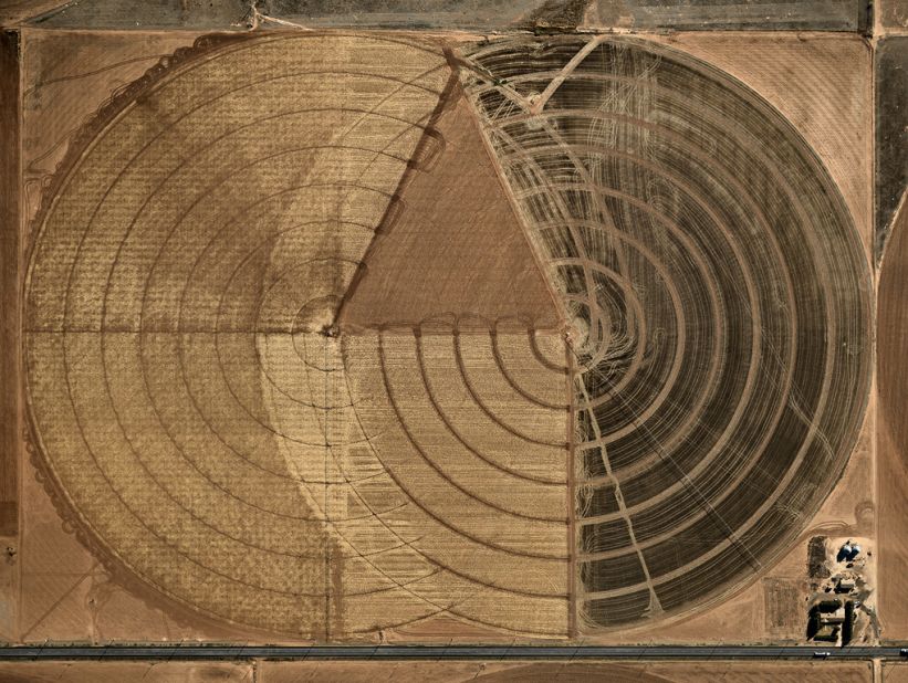 Burtynsky's images often portray man's impact on nature. The "Water" series features images of pivot irrigation, an agricultural method of watering crops with sprinklers. 
