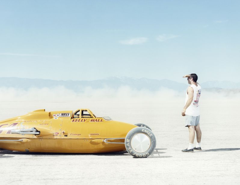 <em>American Land Speed Racer </em><br /><br />"American speed racers fly across salt flats at speeds of over 600 kph (373 mph). Trying to capture speed on camera is really kind of absurd." he writes. "It was photographer Markus Altmann who came up with the solution, which was to capture a parked car. And some guy staring at a dust cloud moving away." 