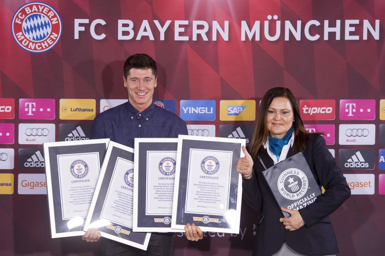 Robert Lewandowski is awarded with four certificates by Guinness World Records after scoring five goals in nine minutes for Bayern Munich against Wolfsburg in September's German Bundesliga clash. He set new records for the most goals scored by a substitute, the fastest hat-trick, and the quickest four and five-goal hauls. 