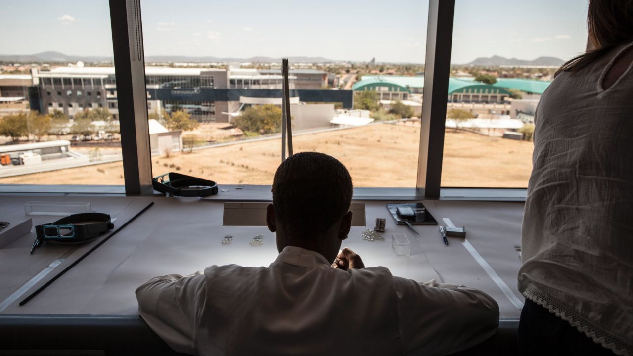 An expert inspects Canadian diamonds at De Beers' Sightholder Sales facility in Gaborone, Botswana