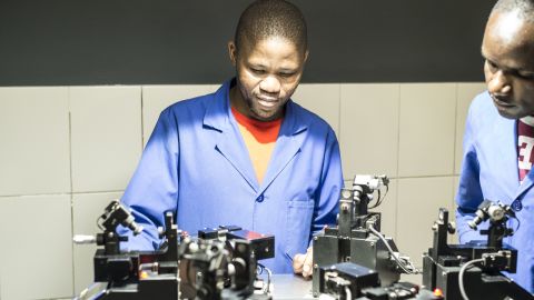 A KGK Diamonds employee polishes a diamond at the company's factory in Gaborone, Botswana. 