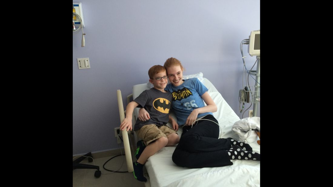 Sarah and her friend Tucker Beau, who also has juvenile arthritis, received stem cell treatments together in hopes of curing their disease. They wear Batman shirts to support each other. 