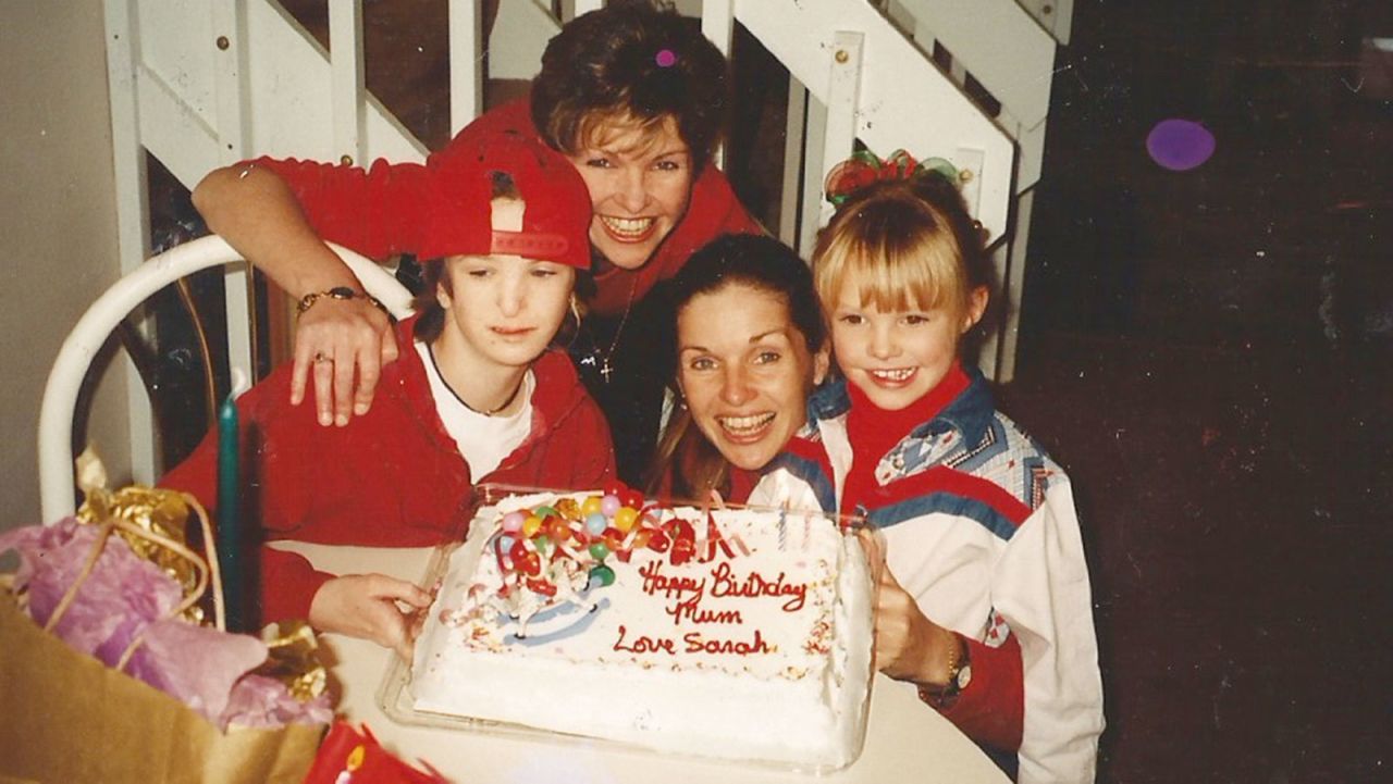 This was the last birthday together for the twins before Sarah Jane died. Also pictured are Sarah (right, with Fiona) and Sarah Jane's daughter, Allison (left).<br />