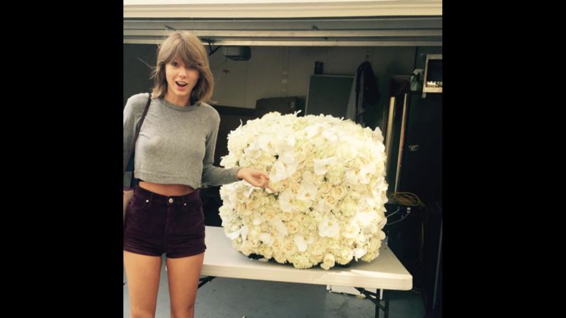 Taylor Swift's photo of her <a href="https://www.instagram.com/p/7OZIdGDvFT/" target="_blank" target="_blank">posed next to flowers</a> sent by Kanye West ranks as the second most-liked photo on Instagram. It got 2.6 million likes in 2015.