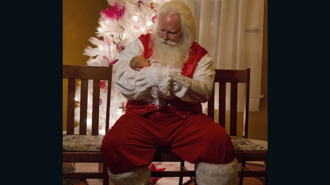 Santa Rick holds Hailey Green a few hours before she passes away.