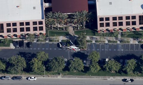 A police helicopter hovers around the Inland Regional Center.