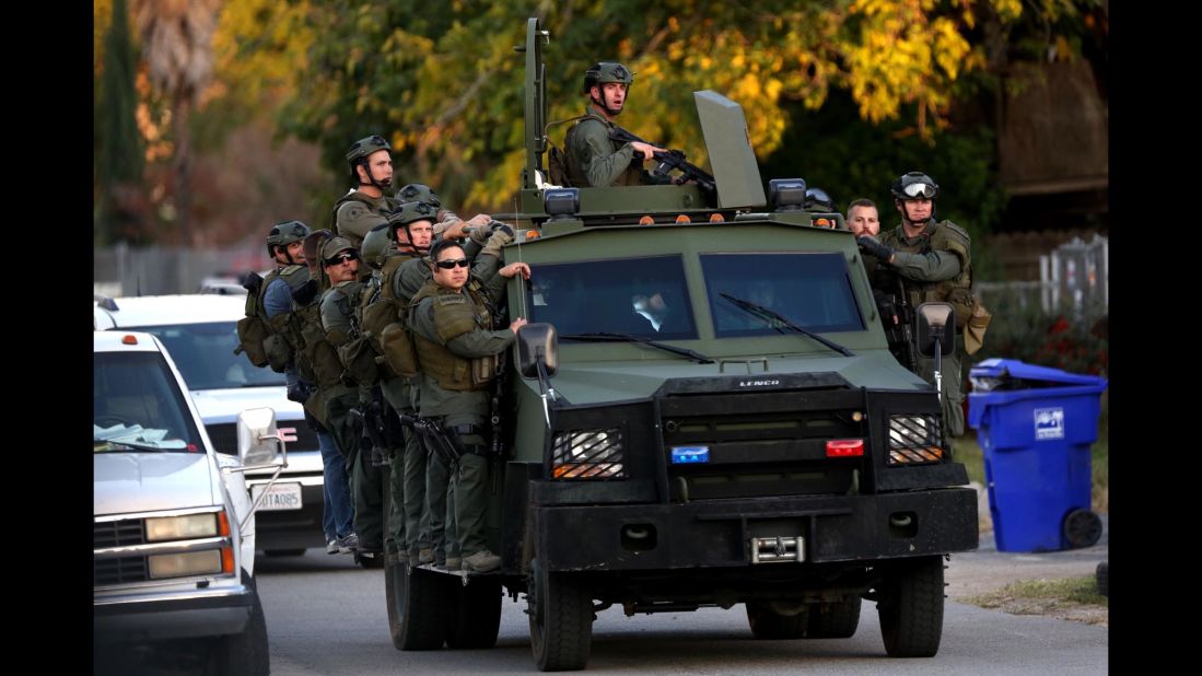 A SWAT team mobilizes during the search.