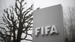 A photo taken on December 3, 2015 in Zurich, shows the sign of the FIFA at the entrance of their headquarters. 
In a dramatic widening of the FIFA corruption scandal, Swiss police arrested two more top football officials in a dawn raid Thursday on suspicion that they accepted millions of dollars in bribes. / AFP / FABRICE COFFRINI        (Photo credit should read FABRICE COFFRINI/AFP/Getty Images)