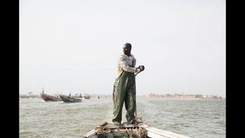 This past March, Greta Rybus spent a month working on a photo series in Saint-Louis, Senegal. This photo shows Aye Sarr at the helm of his large, wooden fishing boat. Most fishermen live in Guet Ndar, an overpopulated area coping with rising sea levels.