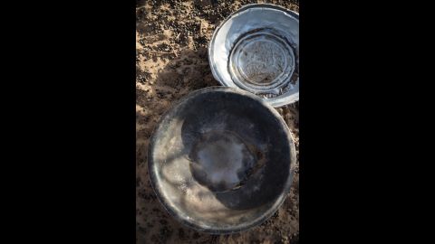 This photo shows empty food bowls for herd animals. With increasingly erratic and sparse rains, food supplies for herders dwindle.