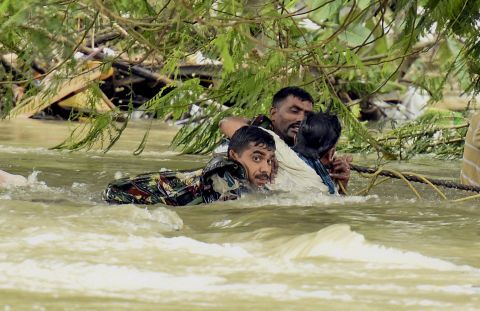 Indian army soldiers rescue a man from flood waters in Chennai, India, December 3.