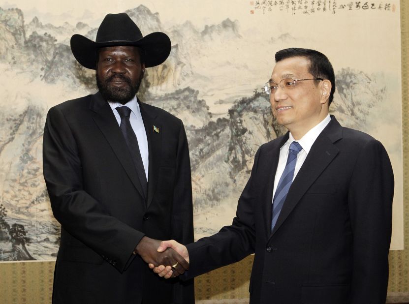 South Sudan President Salva Kiir (L) shakes hands with Chinese Vice Premier Li Keqiang during a visit to Zhongnanhai in Beijing on April 25, 2012.  South Sudan's leader kicked off a visit to Beijing on April 24 with the hosts keen to defuse a raging dispute between the fledgling nation and neighbouring Sudan that threatens Chinese oil supplies. 