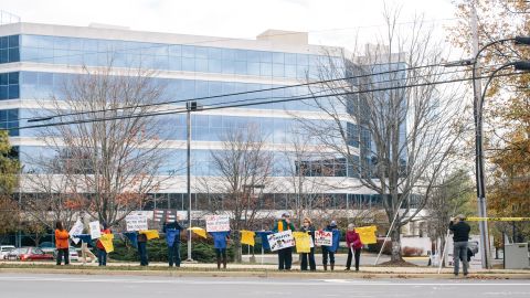 Each month, protesters roam the sidewalk, hold signs and encourage passersby to honk their horns in support.