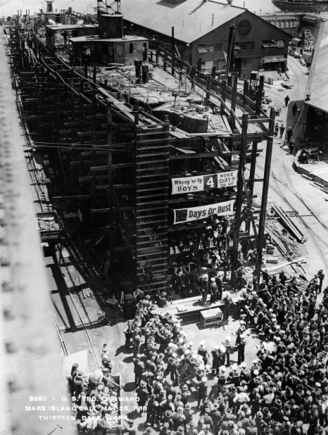 A military steel vessel during construction circa 1917. The photo illustrates the effort the U.S. went to during WWI. The image is taken on day 13 of a 17-day build. 