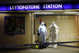 Police investigate the scne at the Leytonstone Tube station late Saturday.