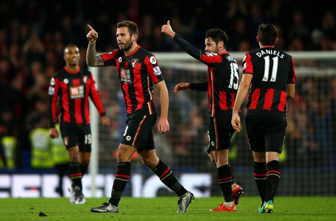 Bournemouth players celebrate their stunning 1-0 win at Chelsea thanks to Glenn Murray's late goal. 