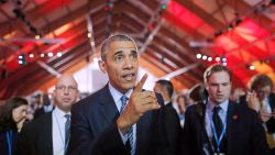 US President Barack Obama walks in the main conference hall of the COP21, United Nations Climate Change Conference, in Le Bourget, outside Paris, on November 30, 2015. More than 150 world leaders are meeting under heightened security, for the 21st Session of the Conference of the Parties to the United Nations Framework Convention on Climate Change (COP21/CMP11), also known as "Paris 2015" from November 30 to December 11. AFP PHOTO/POOL/STEPHANE MAHE / AFP / POOL / STEPHANE MAHE        (Photo credit should read STEPHANE MAHE/AFP/Getty Images)