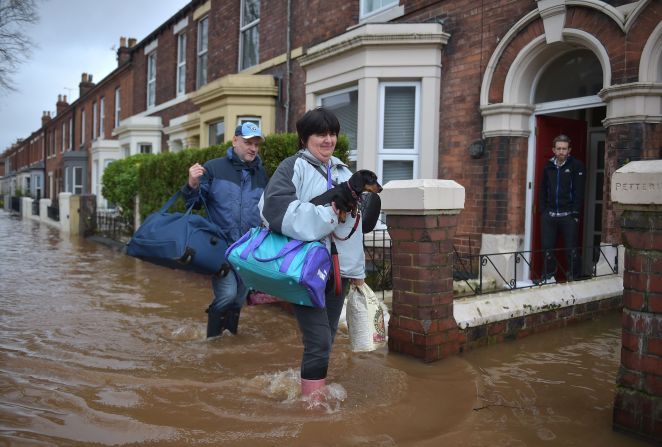 Local residents in Carlisle leave their homes December 6.