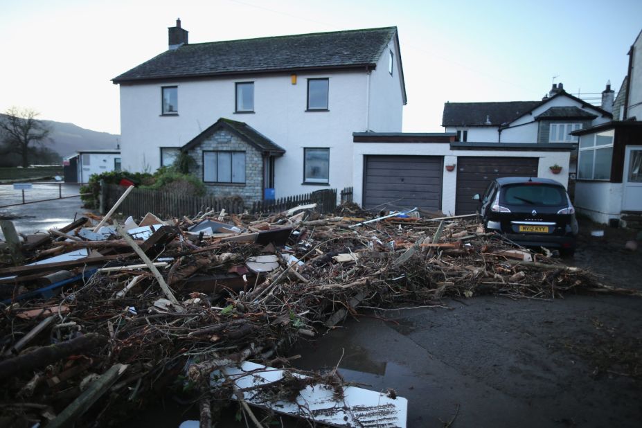 A pile of debris is pictured December 6 outside a house in Keswick, northern England, as people begin the cleaning up after flooding.