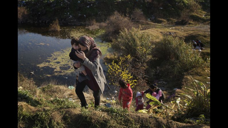 Migrants climb up a hill near the border between Greece and Macedonia.