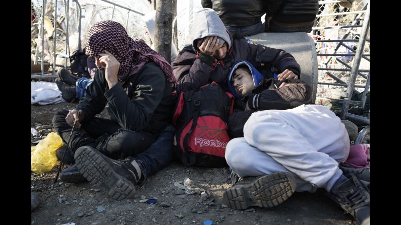 Migrants lay exhausted waiting to enter Macedonia.