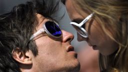 Overall World Cup winner Austria's Marcel Hirscher (L) looks on next to his girlfriend Laura (R) at the FIS Alpine Skiing World Cup finals in Schladming on March 18, 2012.  AFP PHOTO / FABRICE COFFRINI (Photo credit should read FABRICE COFFRINI/AFP/Getty Images)