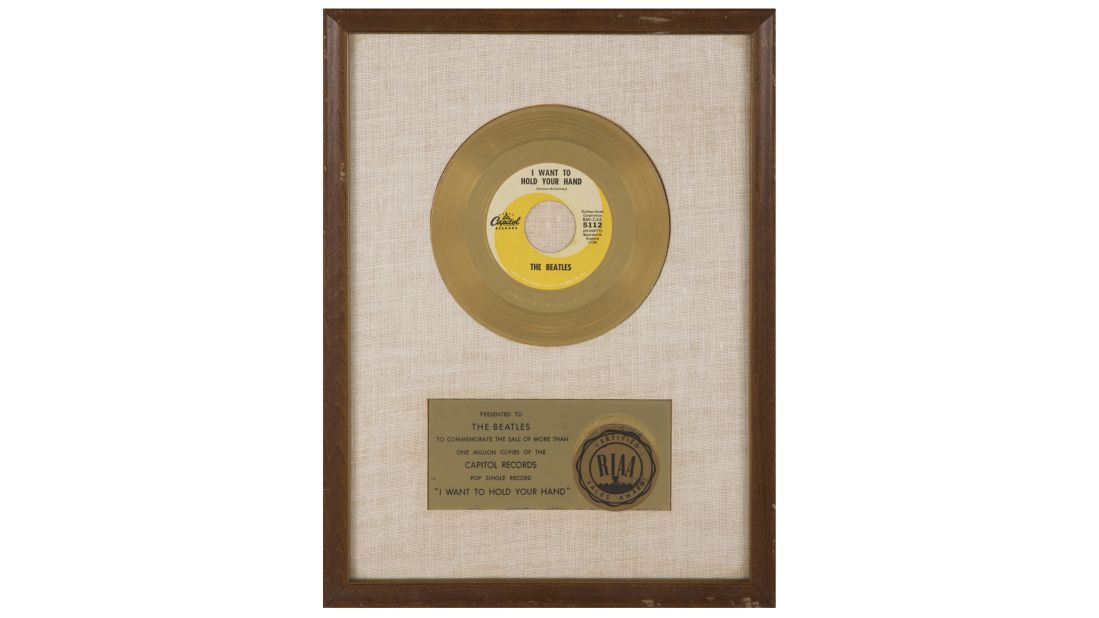 This framed gold record award was presented to the Beatles to commemorate 1 million sales of "I Want To Hold Your Hand." It sold for $68,750.