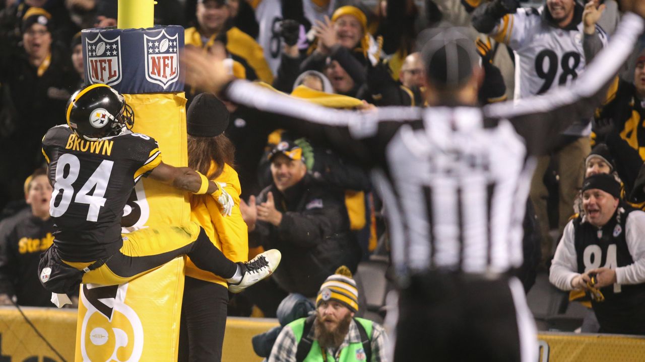Pittsburgh Steelers wide receiver Antonio Brown jumps on a goal post as he celebrates a punt-return touchdown on Sunday, December 6. Brown also had two receiving touchdowns as the Steelers trounced Indianapolis 45-10 in Pittsburgh.
