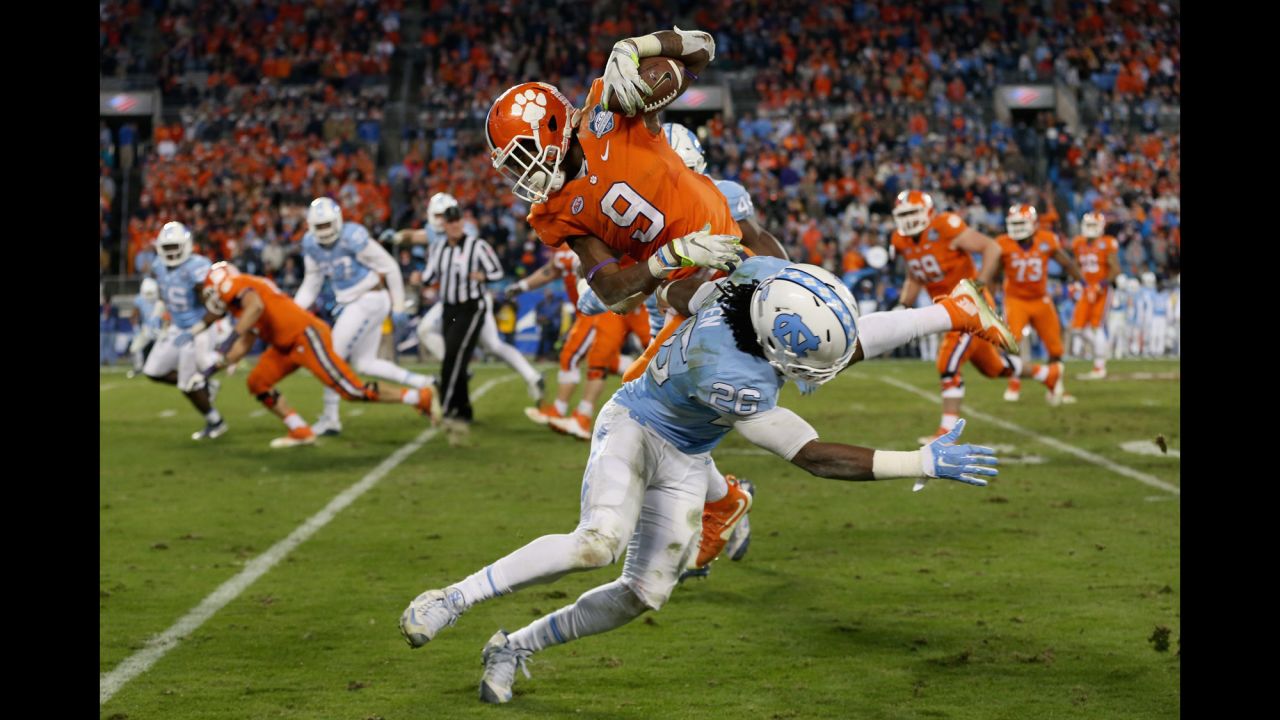 Clemson's Wayne Gallman evades North Carolina's Dominique Green during the ACC Championship game on Saturday, December 5. Clemson won the game 45-37 to clinch a spot in the four-team College Football Playoff. 