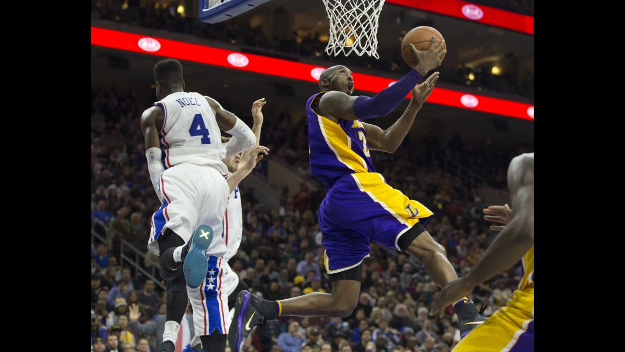 Kobe Bryant lays the ball in during an NBA game in Philadelphia on Tuesday, December 1. The home team defeated Bryant's Lakers, however, for its first victory of the season. The 76ers had begun the season 0-18, tying the worst start in NBA history.