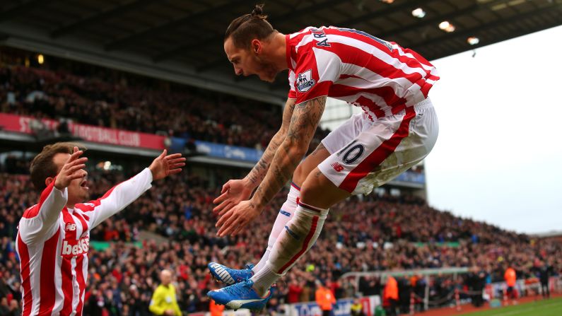 Stoke City's Marko Arnautovic, right, celebrates one of the two goals he scored against Manchester City during a 2-0 victory Saturday, December 5, in Stoke-on-Trent, England. 