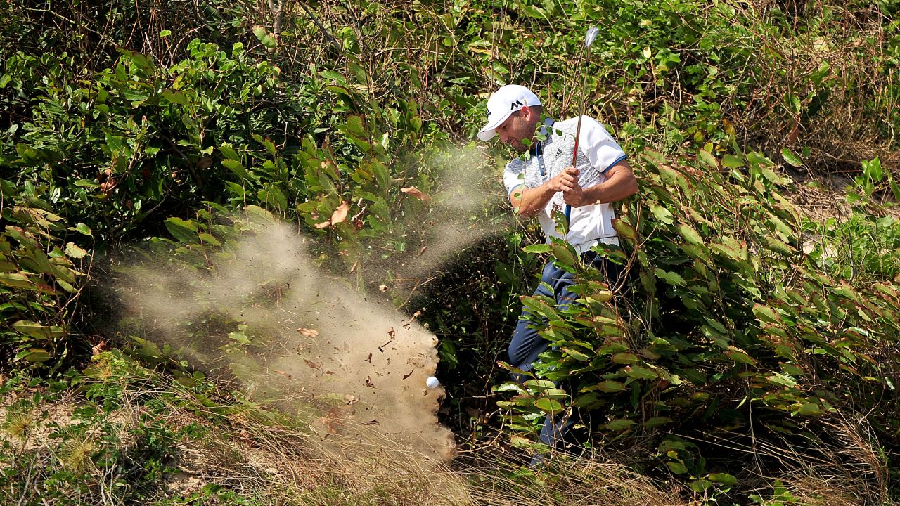 Sergio Garcia plays a shot from a tricky lie Friday, December 4, during an Asian Tour event in Ho Chi Minh City, Vietnam. Garcia eventually won the Ho Tram Open in a four-way playoff.