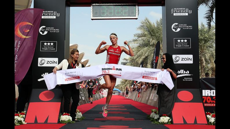 Swiss triathlete Daniela Ryf celebrates after winning the Ironman race in Bahrain on Saturday, December 5. The victory <a href="index.php?page=&url=http%3A%2F%2Fwww.220triathlon.com%2Fnews%2Fdaniela-ryf-wins-million-dollar-triple-crown-at-ironman-703-bahrain%2F10680.html" target="_blank" target="_blank">gave her $1 million</a> because she won each race in the Nasser Bin Hamad Triple Crown.