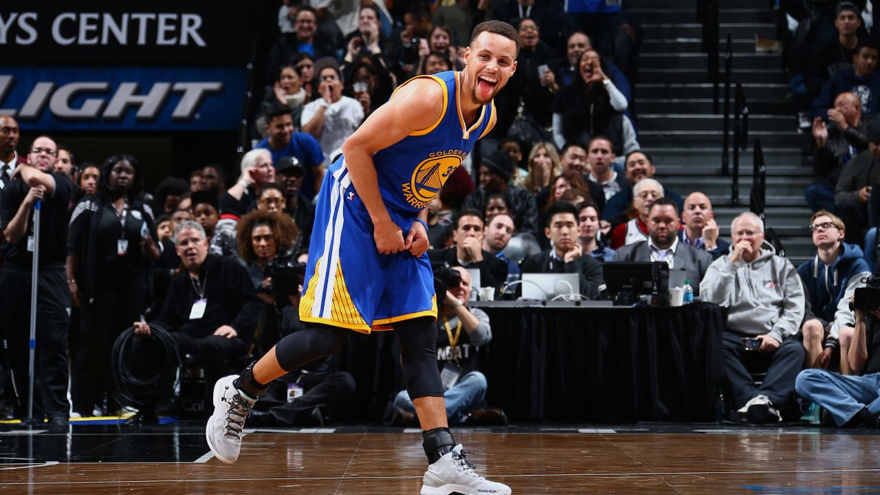 Stephen Curry sticks his tongue out during an NBA game in New York on Sunday, December 6. Curry and the Golden State Warriors beat the Brooklyn Nets 114-98, improving their record this season to 22-0. It's the best start ever to an NBA season.