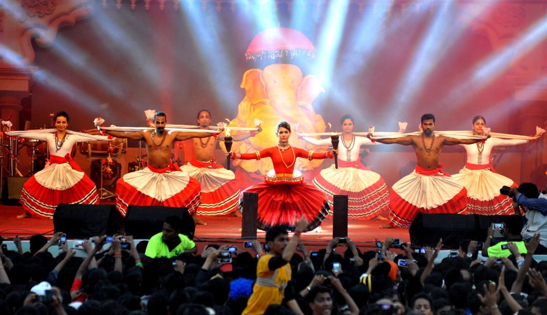 On top of being the richest and most populous city in India, Mumbai is home to Bollywood. Indian Bollywood actress Isha Sharvani (center in the picture) performed during the Hindu festival Janmashtami, the birth of Hindu god Lord Krishna, in Mumbai in 2014. 