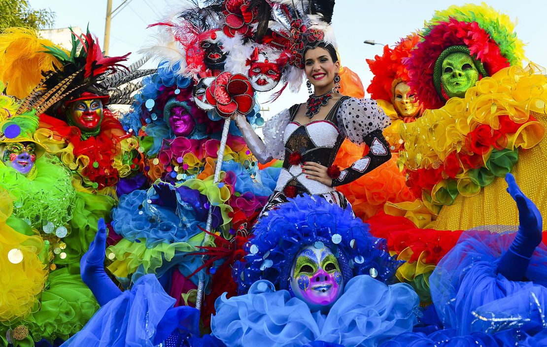 Carnival's Queen Daniela Cepeda poses with dancers during the carnival in Barranquilla, Colombia.