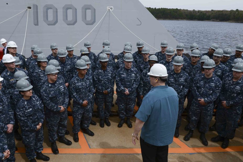 Deputy Defense Secretary Bob Work speaks with the Zumwalt crew during a visit to Bath Iron Works in Bath, Maine, on May 12. Work toured the ship and observed its progress. One thing that sets the $3 billion ship apart is its very small crew. Compared with about 300 sailors needed for similar warships, the Zumwalt's minimum compliment is only 130. The smaller crew is made possible by advanced automated systems which "make it much easier and much more effective for the sailor to operate," says former Navy Capt. Wade Knudson, who now serves as Zumwalt program director for Pentagon contractor, Raytheon. 