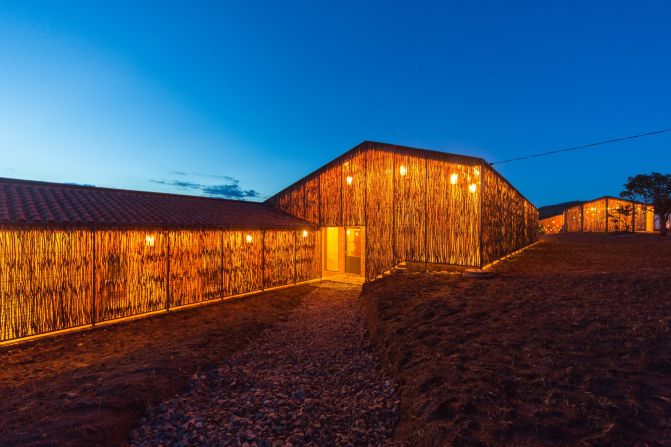 Despite its aesthetic qualities, this building is actually housing for the workers of a local hospital in Rwinkwavu, Rwanda. It was designed by Sharon Davis, whose company was approached by NGO Partners in Health to design low-cost housing for their medical staff and the staff of the Rwandan Ministry of Health. <br /><br />"They asked us for 16-20 rooms to be built for about half the cost they were typically building for," she says. "The project was design and built in partnership with RVE and was built on budget and within a one year time frame."