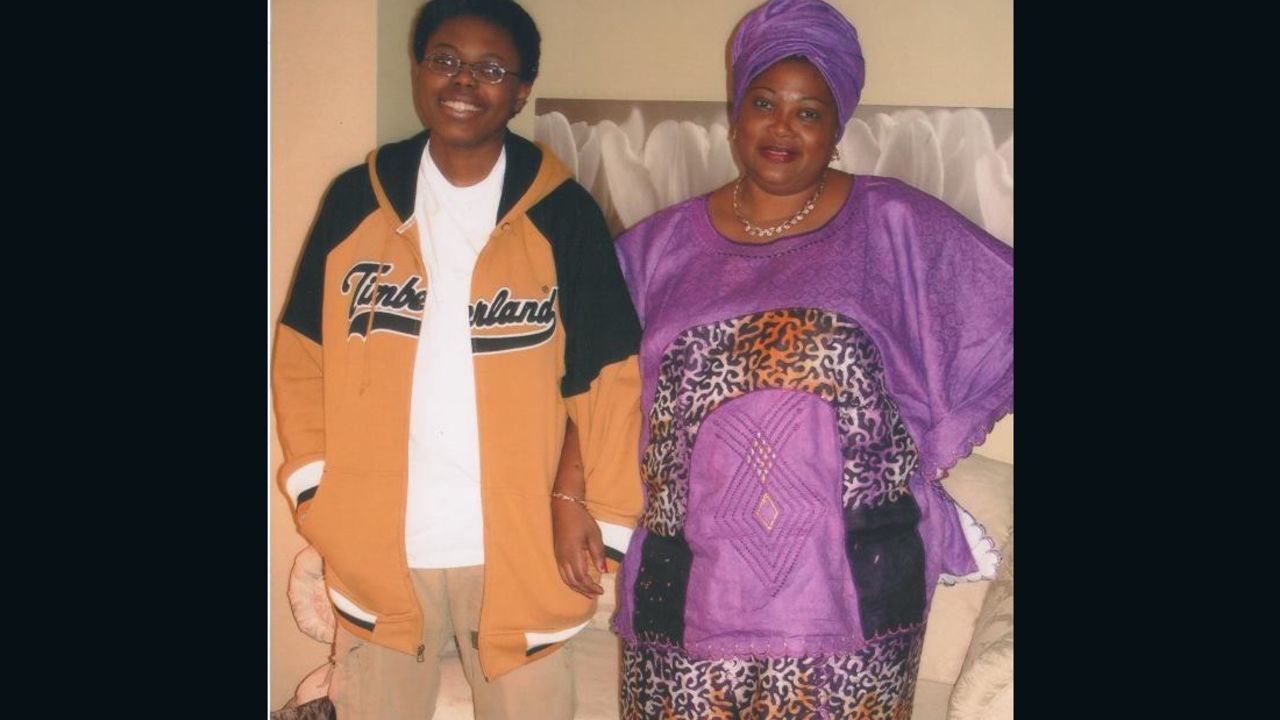 Neo Sandja poses for a photo with his mom, Vicky, in April 2006 in Forest City, Iowa.