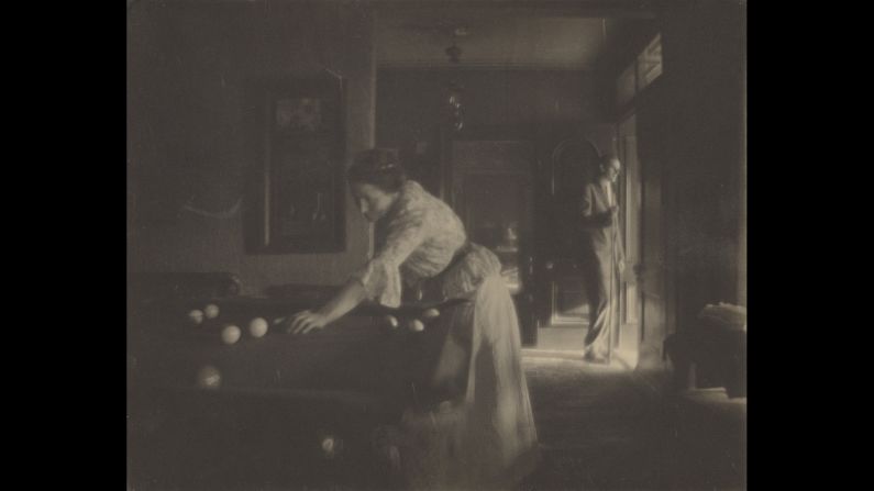 American photographer Gertrude Kasebier (1852-1934) took this photo of her daughter playing pool circa 1909.
