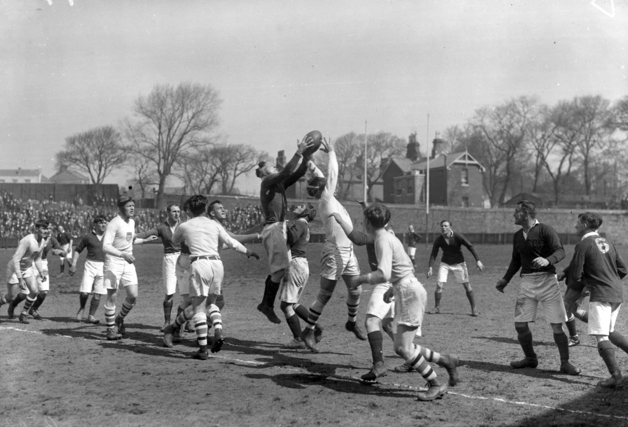 The last time rugby was included at the Olympics was in 1924 in Paris. Here the U.S. (in white) takes on Devonport Services in a warmup game in April that year. 