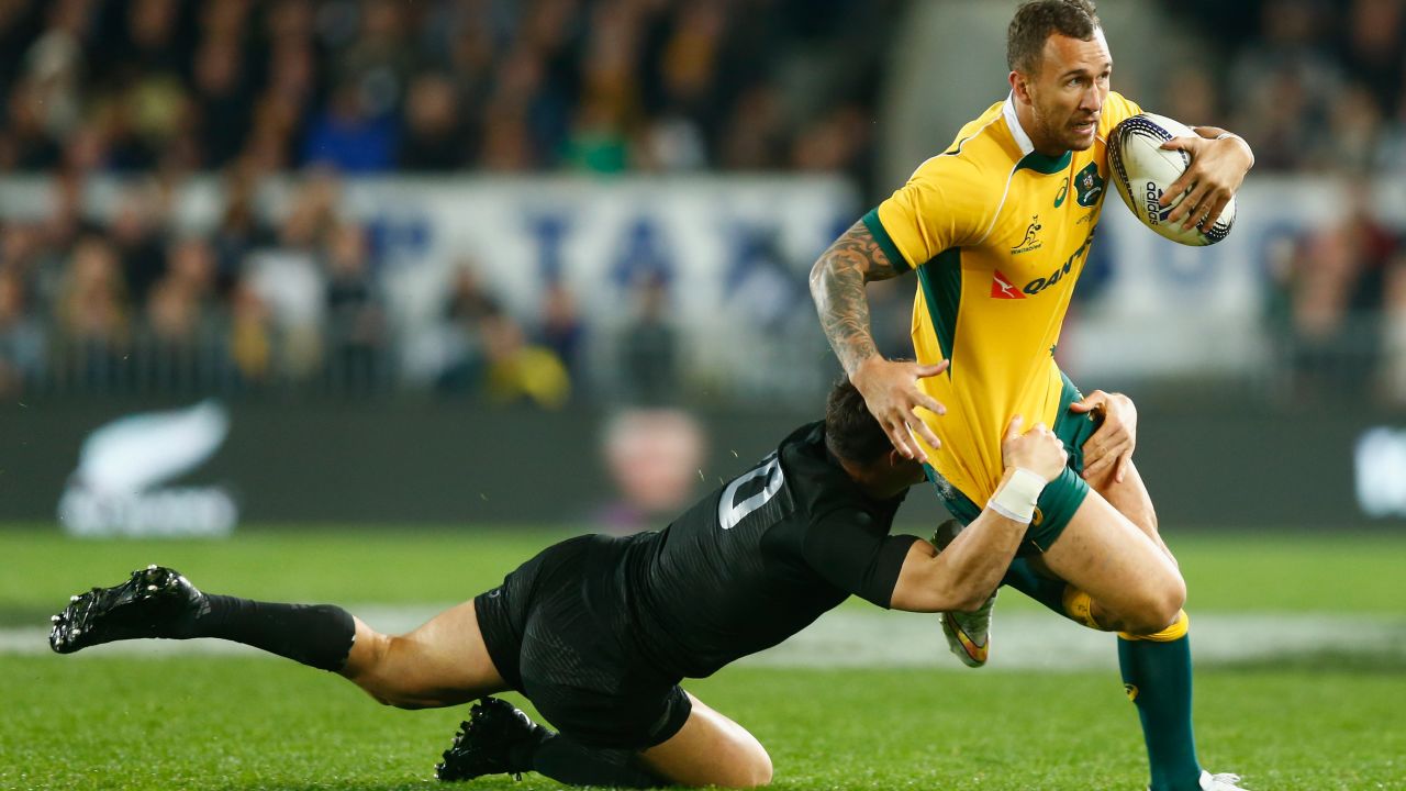 AUCKLAND, NEW ZEALAND - AUGUST 15:  Quade Cooper of the Wallabies is tackled by Dan Carter of the All Blacks during The Rugby Championship, Bledisloe Cup match between the New Zealand All Blacks and the Australian Wallabies at Eden Park on August 15, 2015 in Auckland, New Zealand.  (Photo by Phil Walter/Getty Images)