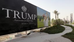 US real-estate magnate Donald Trump is seen playing golf on a billboard at the Trump International Golf Club Dubai in the United Arab Emirates on August 12, 2015. The empire of White House hopeful Donald Trump outside the United States extends to 12 countries including Turkey, South Korea, India, Brazil, and the United Arab Emirates. AFP PHOTO / KARIM SAHIB        (Photo credit should read KARIM SAHIB/AFP/Getty Images)