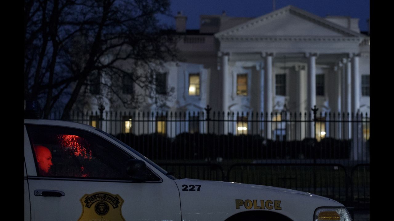 A member of the Secret Service's Uniformed Division sits in his car outside the White House after a small drone <a href="http://www.cnn.com/2015/01/26/politics/white-house-device-secret-service/" target="_blank">crashed on the premises</a> Monday, January 26. The drone posed no threat, said a spokesman for President Obama, and Obama was in India at the time. The drone's owner and operator worked for the National Geospatial-Intelligence Agency, a government entity with mapping and national security duties. The agency confirmed that one of its employees was the operator of the drone, saying the employee was off-duty and the drone flight was not work-related.