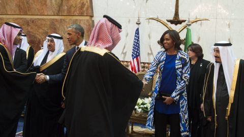 President Obama and first lady Michelle Obama shake hands with delegation members in Riyadh, Saudi Arabia, on Tuesday, January 27. Obama was in the country to meet Saudi King Salman, right, and offer condolences on the death of his predecessor, King Abdullah.