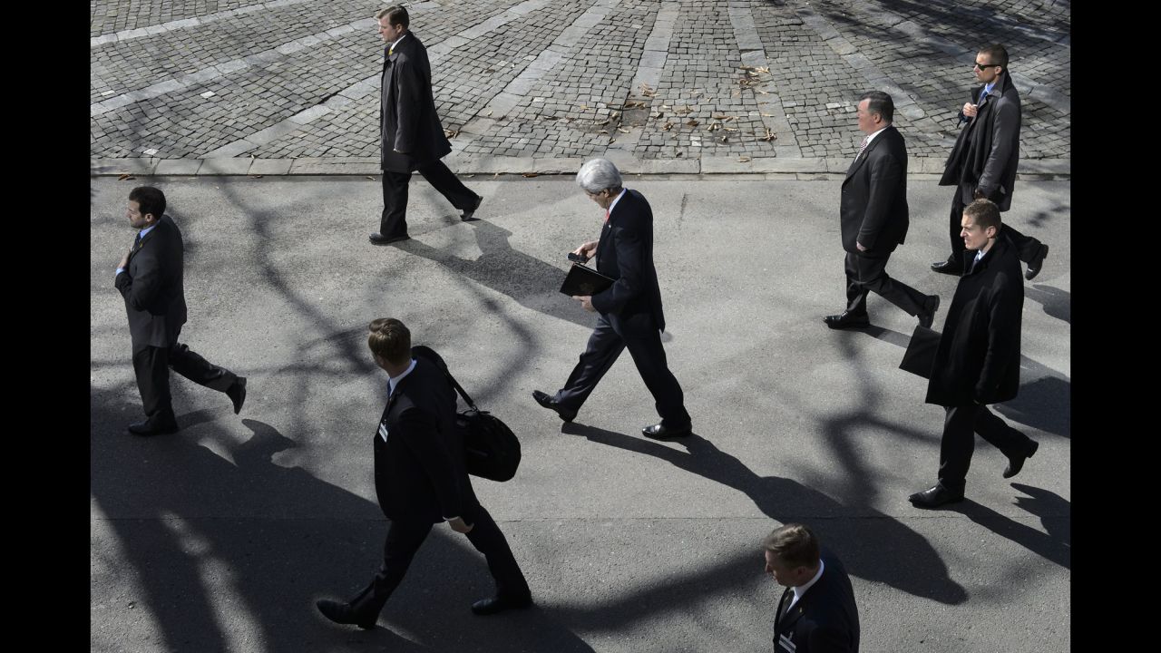 U.S. Secretary of State John Kerry looks at his phone during a lunch break Tuesday, March 3, in Montreux, Switzerland. Kerry was meeting with Iran's foreign minister for a new round of nuclear talks.