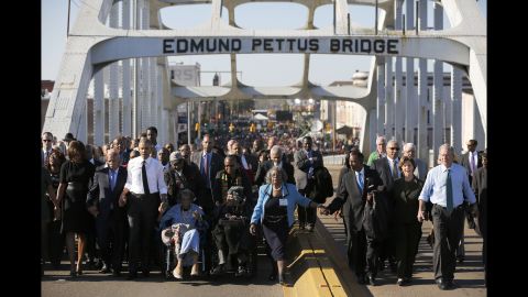President Barack Obama, on the left in the white shirt, and former President George W. Bush, on the far right, march across the Edmund Pettus Bridge in Selma, Alabama, on Saturday, March 7. Their wives also joined them for the event, which was held 50 years after <a href="http://www.cnn.com/2015/01/06/us/gallery/selma-bloody-sunday-1965/index.html" target="_blank">marchers were brutally beaten</a> as they demonstrated for voting rights.